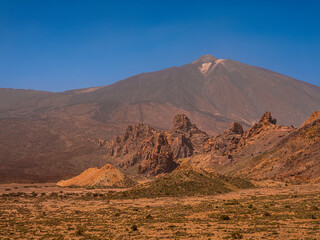 spot in Tenerife with many red rocks and beautiful mountain landscape background
