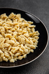 spaetzle egg pasta irregular shape fresh meal food snack on the table copy space food background rustic top view