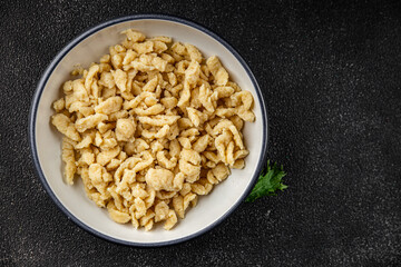 spaetzle egg pasta irregular shape fresh meal food snack on the table copy space food background rustic top view