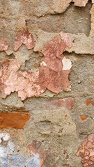 Peeling paint on an old wall. Grunge background for design.Selective focus