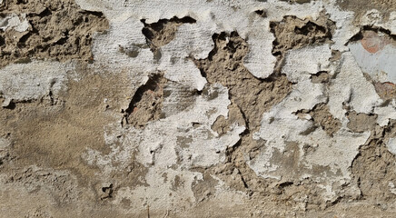 Peeling paint on an old wall. Grunge background for design.Selective focus