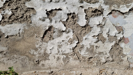 Peeling paint on an old wall. Grunge background for design.Selective focus