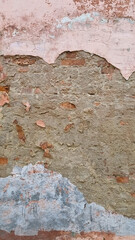 Peeling paint on an old wall. Grunge background for design.Selective focus