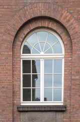 Large mullioned window on a 100-year-old building