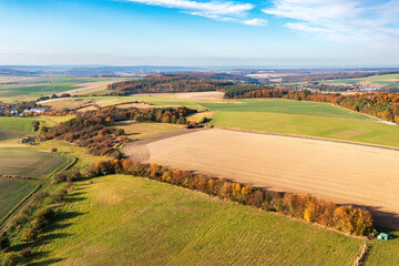 Aerial view of forests and meadows in the Taunus with autumnal colors