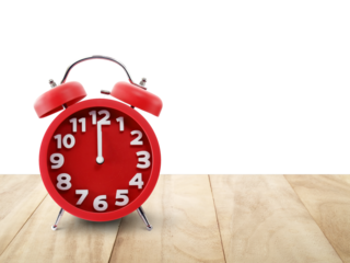 minimalist round red alarm clock on desk floor isolated on transparent with copy space