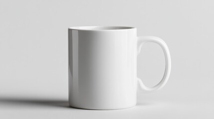 Obraz premium A simple white mug on white background, surrounded by green plants, creates serene and minimalist atmosphere. This composition highlights elegance of simplicity and nature