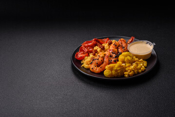 Boiled tiger shrimps with porridge, tomatoes and corn