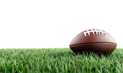 Leather American football resting on vibrant green grass isolate on transparent background, cutout, png