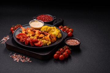 Boiled tiger shrimps with porridge, tomatoes and corn