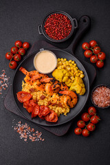 Boiled tiger shrimps with porridge, tomatoes and corn