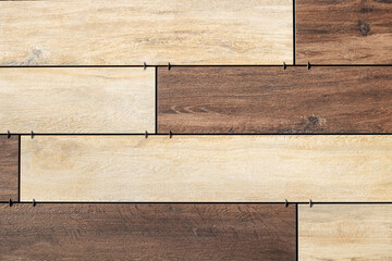 Closeup view of a wooden floor with embedded nails