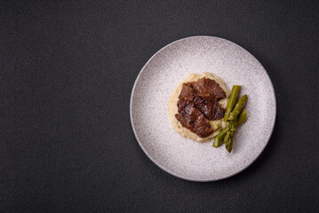 Juicy beef or pork cut into slices with boiled asparagus