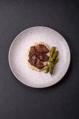 Juicy beef or pork cut into slices with boiled asparagus