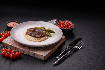 Juicy beef or pork cut into slices with boiled asparagus