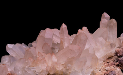 Mineral rock featuring clear quartz crystals with natural geometric formations