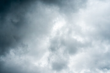 Dark dramatic storm cumulus clouds in autumn. An impending storm, hurricane or thunderstorm. Bad weather.