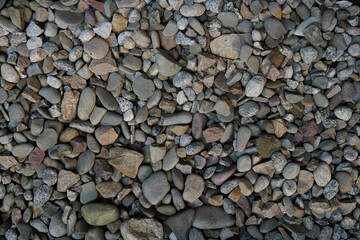 Processed collage of sea shore pebbles texture. Background for banner, backdrop or texture for 3D mapping