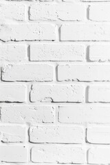 Fototapeta premium a white brick wall with a black and white photo