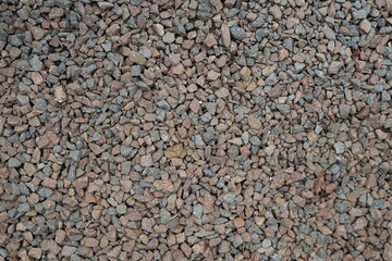 Processed collage of sea shore pebbles texture. Background for banner, backdrop or texture for 3D mapping
