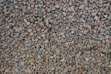 Processed collage of sea shore pebbles texture. Background for banner, backdrop or texture for 3D mapping