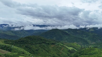 Obraz premium Beautiful aerial mountains, clouds and mist over the mountains