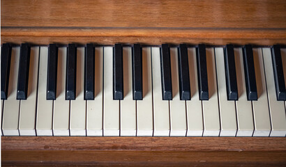 Close-up, keys of an antique wooden piano.