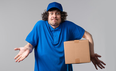 Confused postal courier man, shoulders up - can't help,makes gesture I dont know