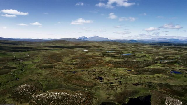 Drone flying backwards over the stunning landscapes of Flatruet high fell in Sweden, with an aerial perspective revealing the beauty of this untouched wilderness