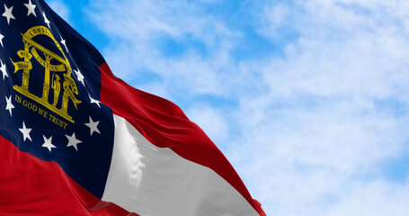 Close-up of Georgia state flag waving in the wind on a clear day © rarrarorro