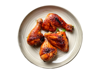 Zenith view of a clear plate with some roast chicken legs. Transparent background.