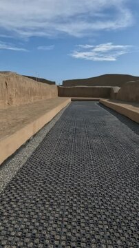 Exploring the pre-Columbian archaeological site of the indigenous Chan Chan people in Trujillo, Peru. This impressive adobe-built city offers a glimpse into ancient Peruvian history. Vertical video