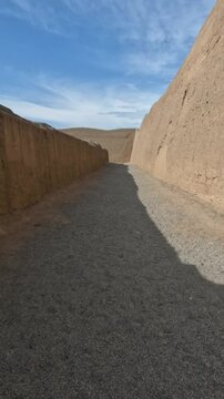 Exploring the pre-Columbian archaeological site of the indigenous Chan Chan people in Trujillo, Peru. This impressive adobe-built city offers a glimpse into ancient Peruvian history. Vertical video