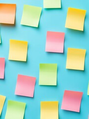 Fototapeta premium A vibrant arrangement of colorful sticky notes on a teal background, symbolizing organization, ideas, reminders, creativity, and communication.