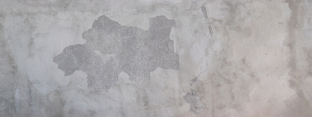 Panoramic texture of a worn wall, concrete surface, light gray color