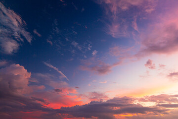 Colorful clouds and sky,Dusk, Sunset Sky Clouds in the Evening with colorful Orange, Yellow, Pink and red sunlight and Dramatic storm clouds on Twilight sky,
