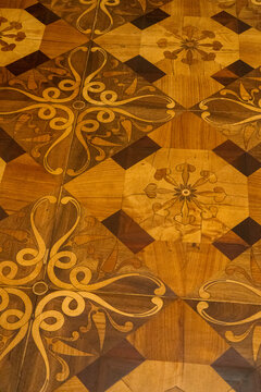 Old wooden parquet from different types of wood. Floor