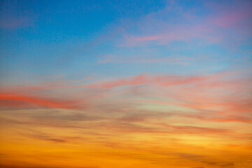Colorful clouds and sky,Dusk, Sunset Sky Clouds in the Evening with colorful Orange, Yellow, Pink and red sunlight and Dramatic storm clouds on Twilight sky,