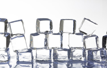 Ice cube isolated on white background,Natural crystal clear melting ice cubes on white reflective...