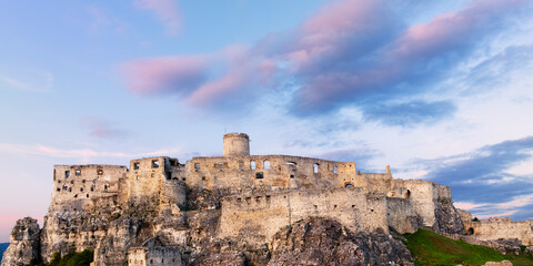 Panorama of the ramparts of the Spis castle (Spisske Podhradie, Slovakia) during the summer sunset
