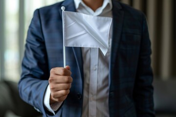 Businessman holding white flag of surrender
