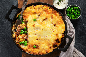 Shepherd’s Pie - ground meat with vegetables, topped with mashed potatoes, and cheese. Baked.
