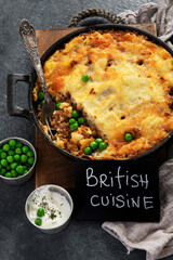 Shepherd’s Pie - ground meat with vegetables, topped with mashed potatoes, and cheese. Baked.