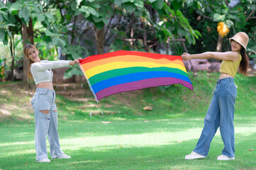 Couple of girl with girl,LGBT Pride month concept,Asian Handsome male make up and wear woman cloth,Gay Freedom Day,Portrait of Non-binary on white background