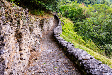Explore the enchanting Sentiero del Viandante, a historic trail on Lake Como's eastern shore, surrounded by lush forests and stunning lakeside views, perfect for nature lovers and hikers.