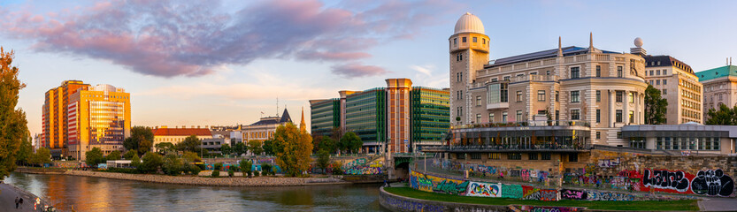 vienna, austria - 17 oct 2019: donaukanal embankment panorama in autumn. urania observatory...