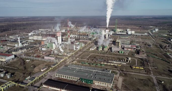 Chemistry Factory in Lithuania, Achema in Jonava City. Clear Blue Sky and Smoke Stacks in Background. Drone