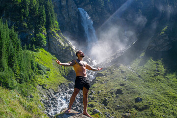 Meditation. Harmony and peace in nature. Calm athlete man meditating in environment. Mindfulness. Relaxed man in nature. Freedom and happiness. Muscular fit man practicing yoga outdoors.