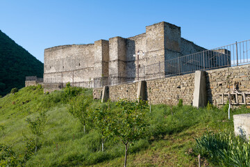 Fototapeta premium View of the ancient fortress of the Seven Brothers and One Sister on a sunny May morning. Khuchni. Republic of Dagestan