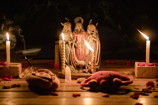 Sao Paulo, SP, Brazil - May 03 2024: Figurine of the Triple Goddess of the Altar: the Maiden, the Mother and the Crone for the Sacred Feminine ceremony details.